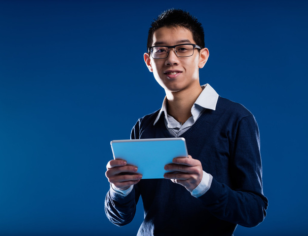 chinese guy smiling holding an ipad - Photo, Image