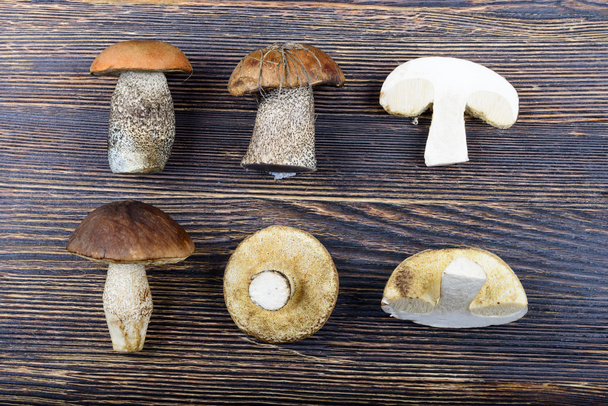 mushrooms on a wooden background - Photo, Image