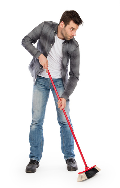 Young worker with a broom - Photo, Image