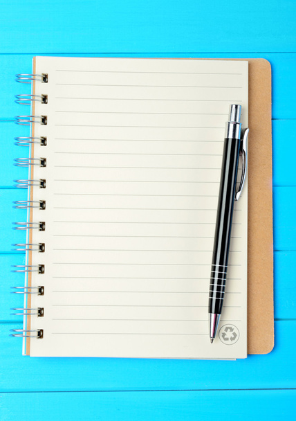 Notebook with pen on table - Φωτογραφία, εικόνα