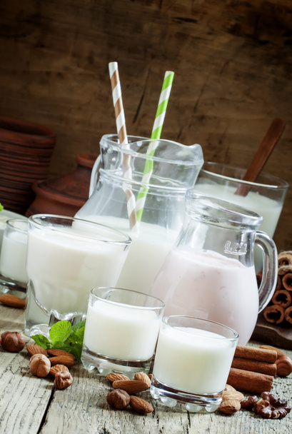 Fresh dairy products and nuts on an old wooden background - Fotografie, Obrázek