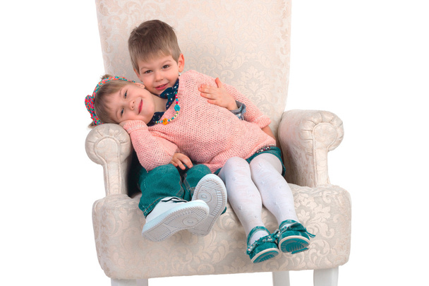 Children sit in a chair - Foto, Imagem