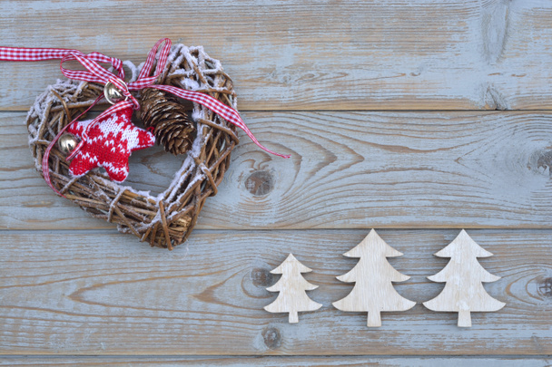 Grey empty copy space wooden background with white and red christmas decoration made of wood - Photo, Image