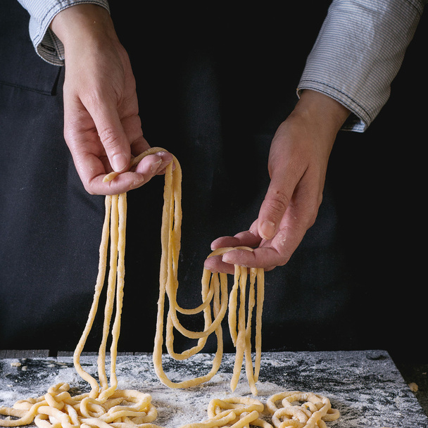 Making pasta by female hands - Foto, Bild