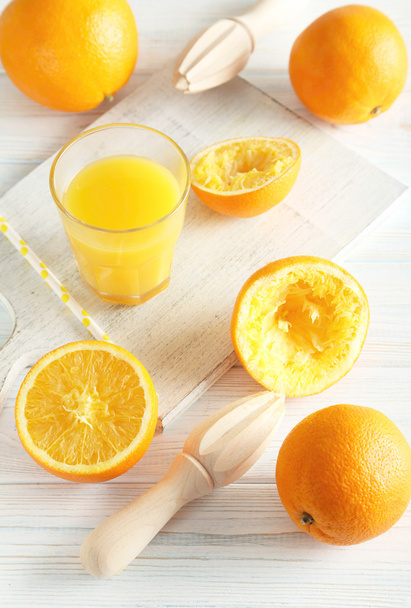 Citrus fruits with juicer  - Фото, изображение