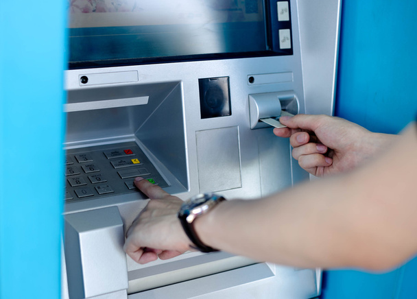 Man's using the ATM machine - Photo, Image