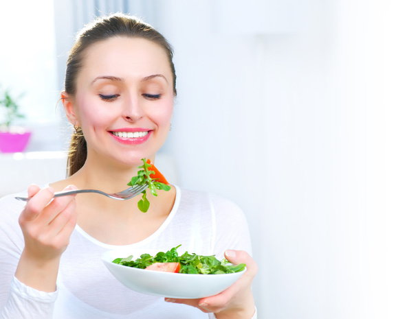 Diet. Healthy Young Woman Eating Vegetable Salad - 写真・画像