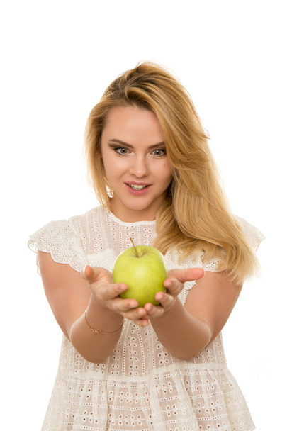 young beautiful girl with Apple in hands isolated on white background - Fotografie, Obrázek