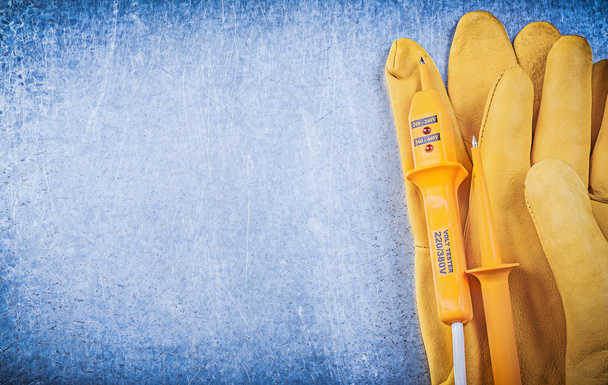 Safety gloves and electric tester - Fotó, kép