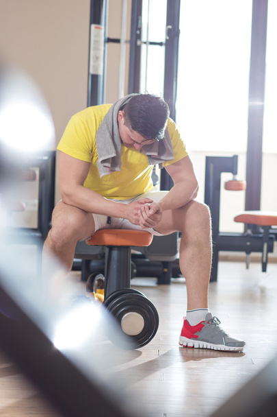 Athlete muscular brutal bodybuilder emotional posing in the gym, - Фото, изображение