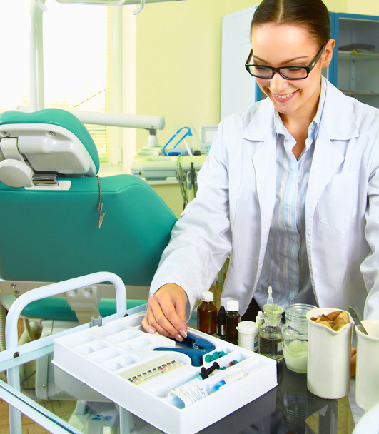 Woman dentist standing near chair - Zdjęcie, obraz