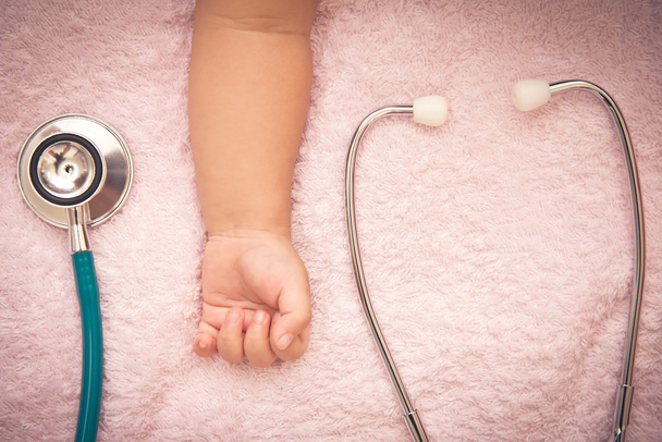 medical instruments stethoscope in hand of baby girl - Fotó, kép