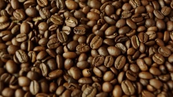 Rotation of aromatic roasted coffee beans - Felvétel, videó