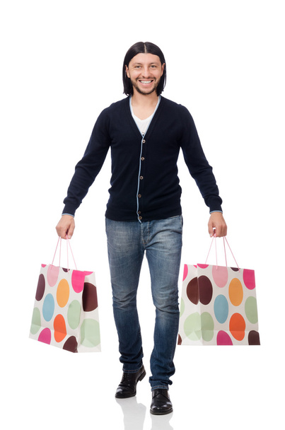 Young man holding plastic bags isolated on white - Foto, Bild