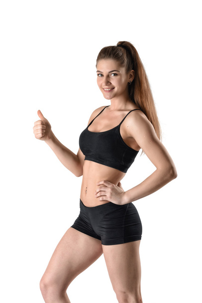 girl in shorts and  top showing thumbs up - Photo, image
