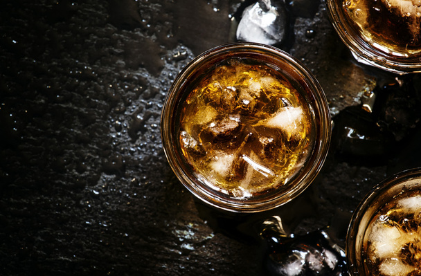Cold whiskey in a glass with crushed ice  - Foto, immagini