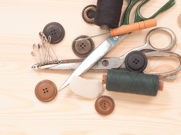 Sewing accessories in a wood background. sewing concept - 写真・画像