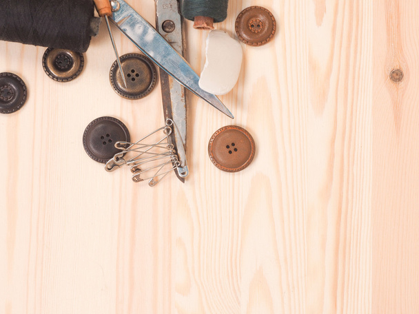 Sewing accessories in a wood background. sewing concept - 写真・画像