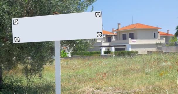 Blank advertising sign in front of the houses - Footage, Video