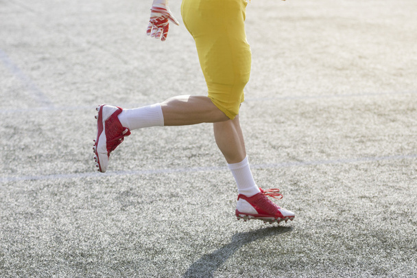 American football player running on the field    - Zdjęcie, obraz