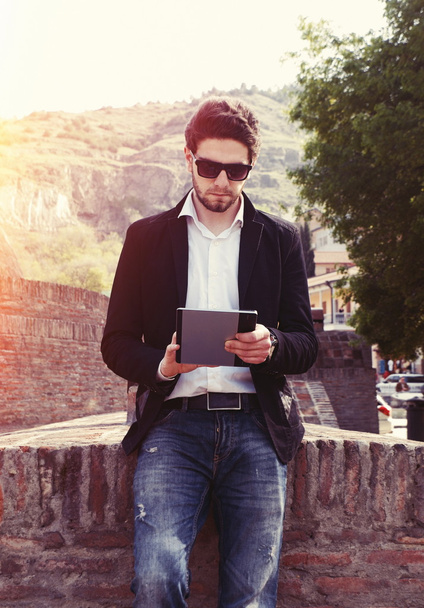 young bearded man outdoors with tablet - Photo, Image