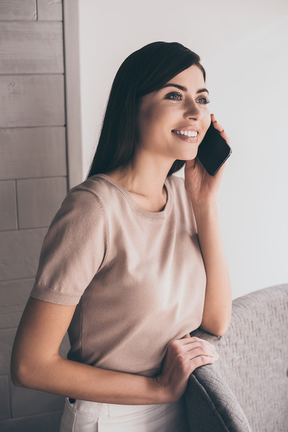 Cheerful woman talking on mobile phone  - Photo, Image