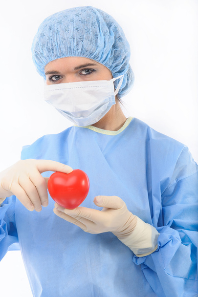 Female doctor holding a heart - Foto, Imagem