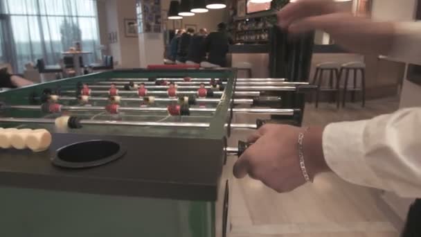 Young couple playing in table football - Footage, Video