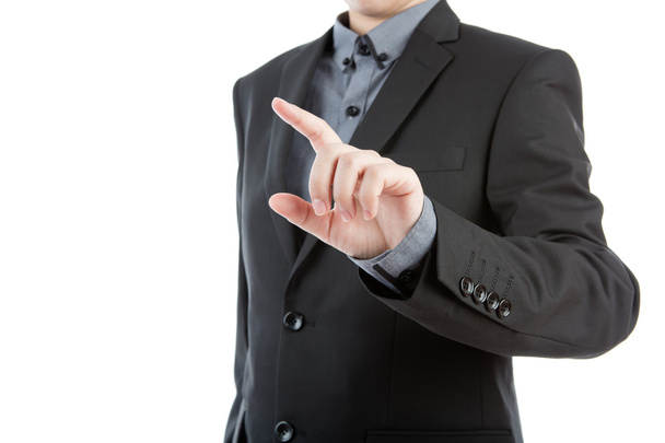 Business man touching an imaginary screen against white backgrou - Photo, Image