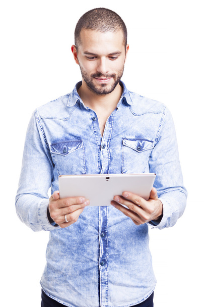 Casual man holding a digital tablet - 写真・画像