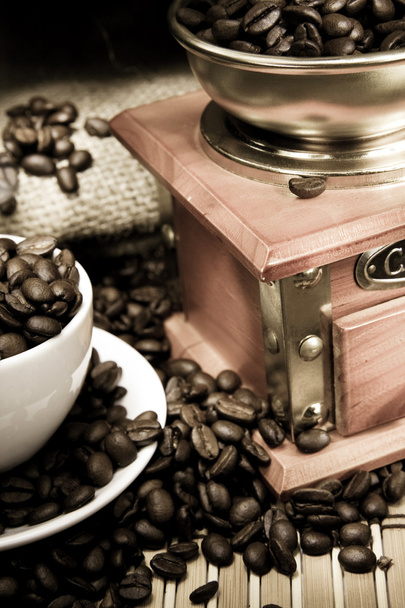 Cup of coffee, beans and grinder on vintage on sacking - Photo, Image