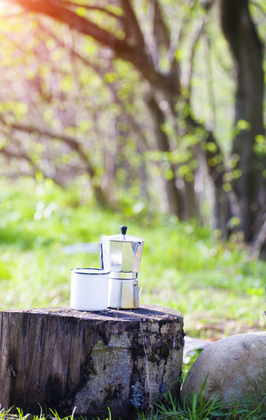 Coffee and mug are camping outdoors. - Фото, зображення