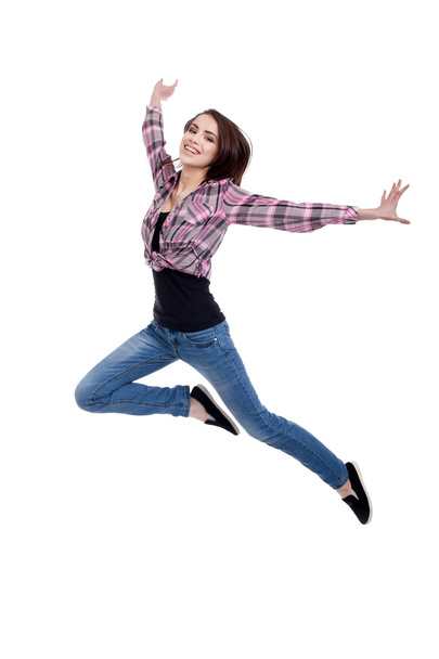 Happy teen girl jumping, isolated on white background - Foto, imagen