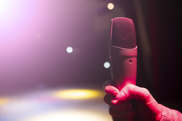 Image the announcer speaks into a microphone. - Foto, Imagem
