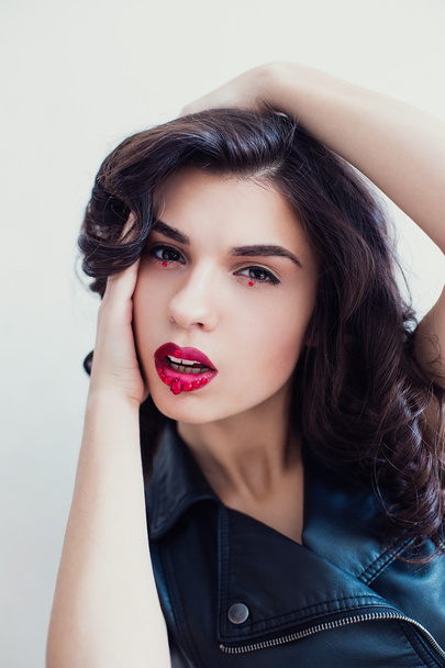 Portrait of curly girl with rhinestones on her lips - Fotografie, Obrázek