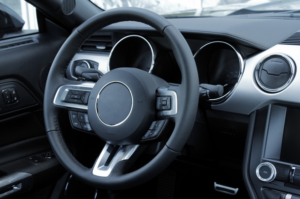 Dashboard and multifunction steering wheel in leather car interior  - Fotoğraf, Görsel