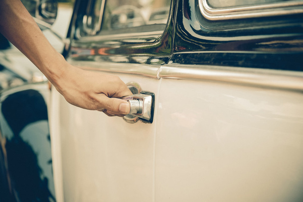man opens the door to a retro car - Photo, Image