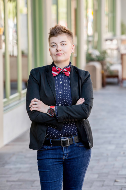 Dapper Gender Fluid Young Woman with Arms Crossed - Foto, Imagen