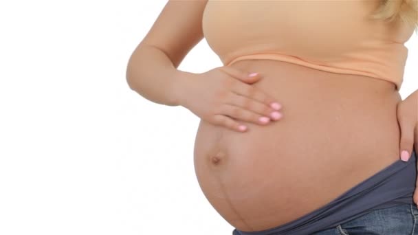 Mujer embarazada frota su vientre
 - Metraje, vídeo