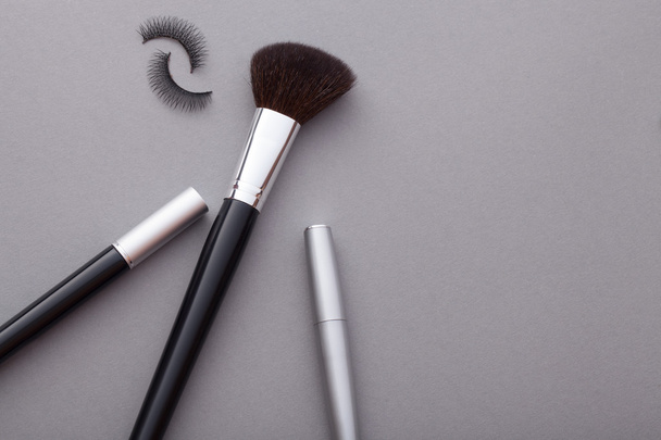 Beautiful makeup on a gray background. - Photo, Image