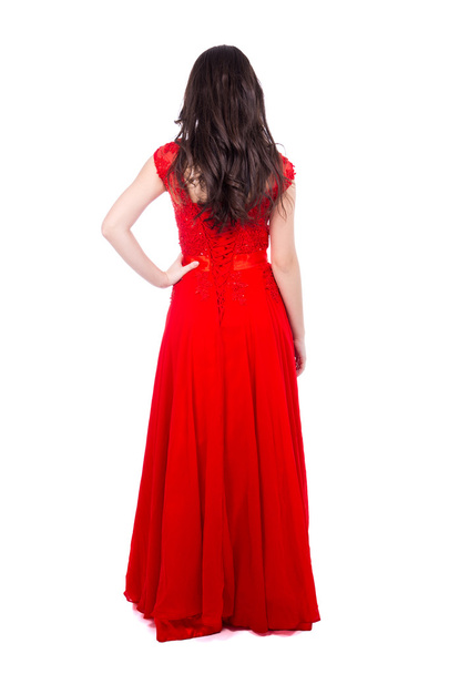 back view of young beautiful woman in red dress isolated on whit - Foto, Imagen