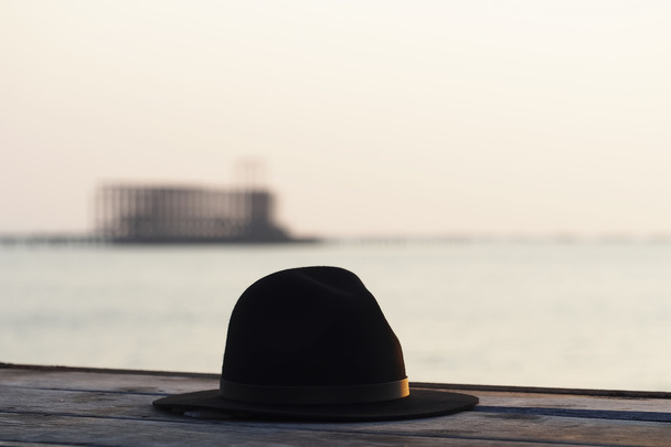 Beautiful black hat fashion background the sunset on the sea, Thailand - Foto, afbeelding