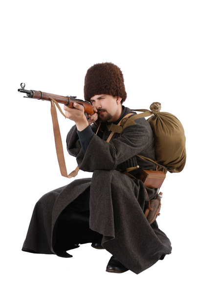 Russian Cossack points a rifle in squatting position. The living - Photo, Image