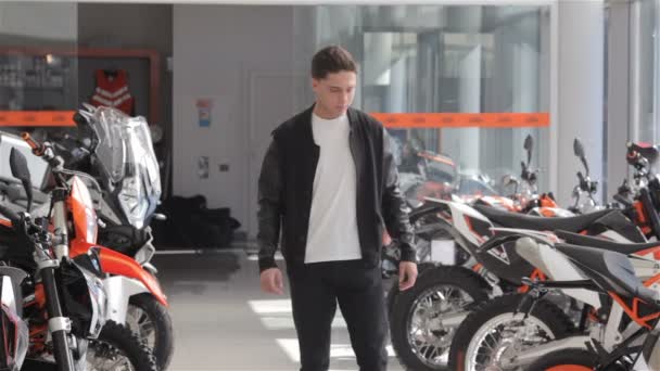 Man choose the motorbike at dealership - Footage, Video