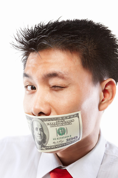 Bribe concept, mouth sealed with dollar bill - Foto, Imagen