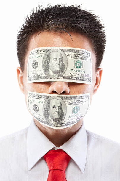 Lahjuksen käsite, silmät ja suu sinetöity dollarin setelillä
 - Valokuva, kuva