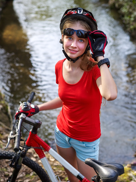 Bikes bicycling girl cycling fording throught water . - Photo, Image