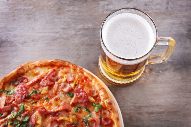 Tasty pizza and glass of beer - Φωτογραφία, εικόνα