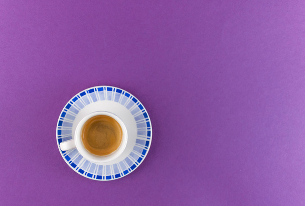 Little cup of coffee on colored background - Photo, image