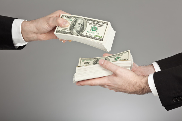 businessman exchange dollar isolated on grey - Zdjęcie, obraz